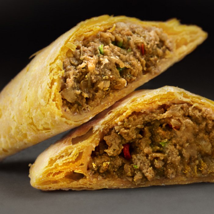 Golden Jamaican beef patties on a plate