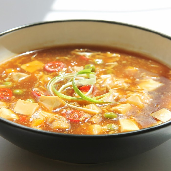 Bubbling pot of kimchi jjigae with tofu